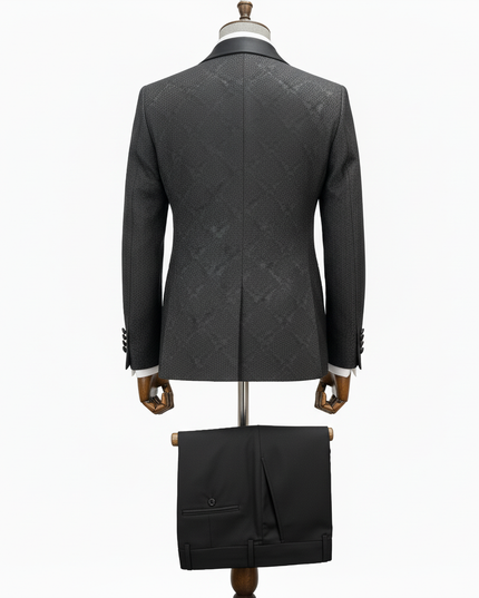 black textured suit jacket on a mannequin against a white background