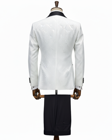 White blazer and black pants on a mannequin against a white background