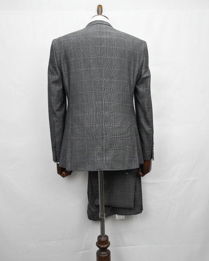 Gray checkered suit on a mannequin against a white background