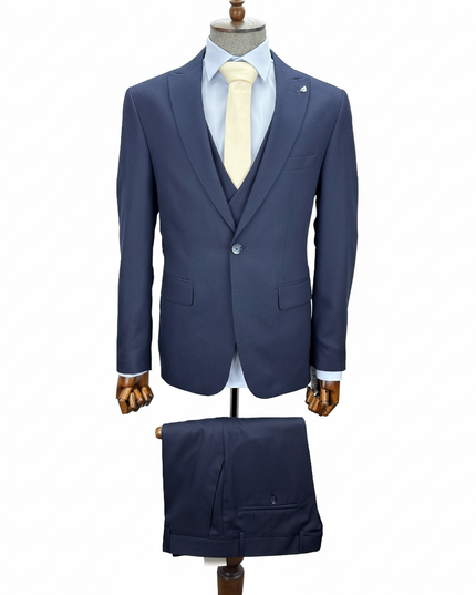 Blue suit on a mannequin with a white background