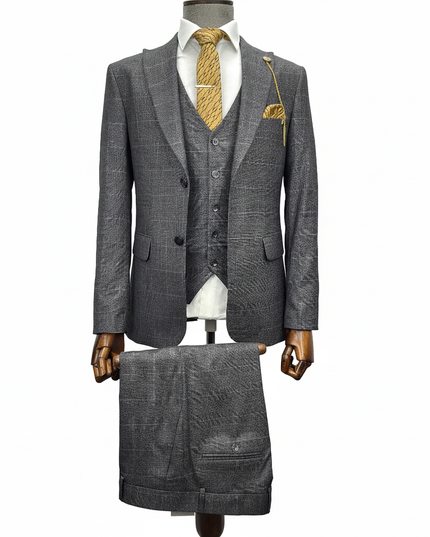 Gray suit with a white shirt and gold tie on a mannequin against a white background