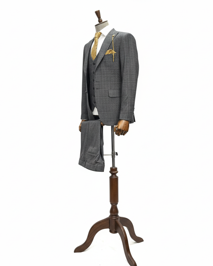 Gray suit on a wooden mannequin stand against a white background