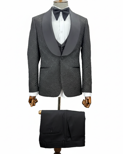 black tuxedo with black bow tie on a mannequin against a white background
