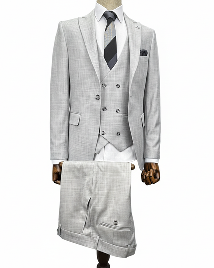 Gray checkered suit with vest and tie on a mannequin against a white background