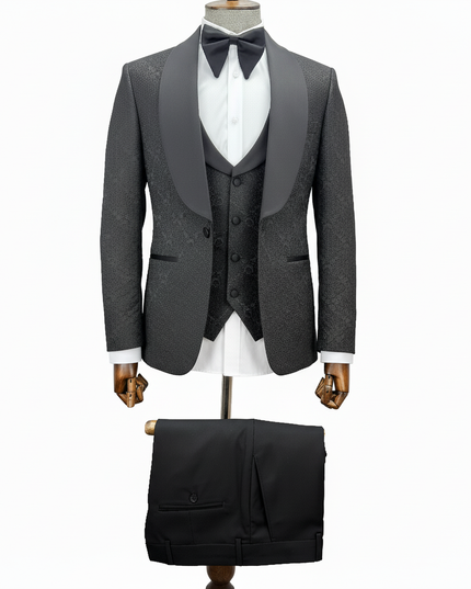black tuxedo with matching vest and pants on a mannequin against a white background