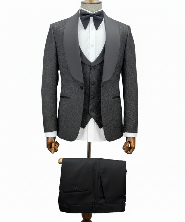 black tuxedo with matching vest and pants on a mannequin against a white background