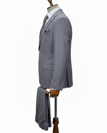 Gray suit jacket on a mannequin with a white background