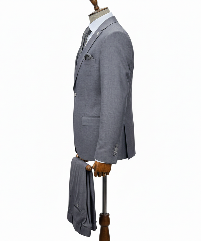 Gray suit jacket on a mannequin with a white background