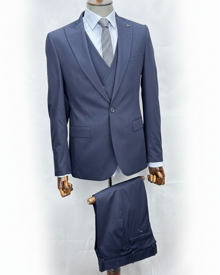 Gray suit with vest and pants on a mannequin against a white background