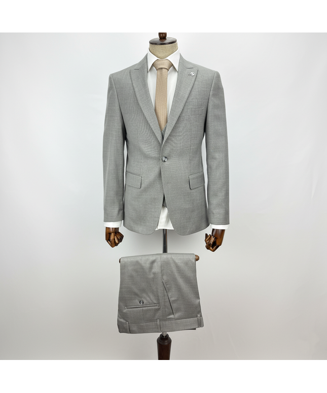 Gray suit on a mannequin against a white background