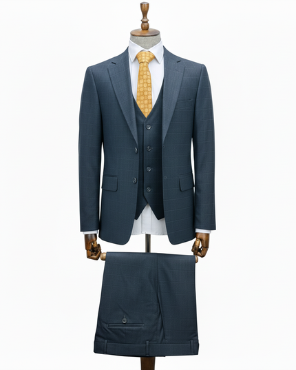 Slate Blue suit with a yellow tie on a mannequin against a white background