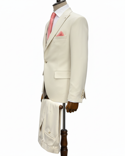 Beige suit on a mannequin with a white background