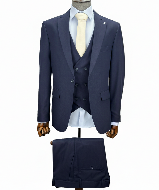 Navy blue suit with white shirt and tie on a mannequin against a white background