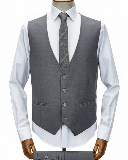 Gray vest over a white shirt with a tie on a mannequin against a white background