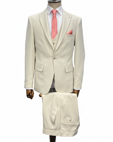 Beige suit with pink tie on a mannequin against a white background