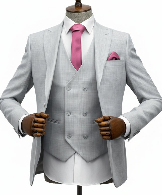 Gray suit with pink tie and pocket square on a mannequin against a white background