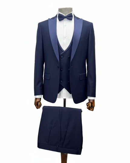 Navy blue tuxedo with satin lapels on a mannequin against a white background