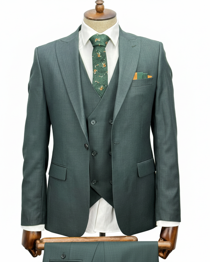 Green suit with vest and tie on a mannequin against a white background