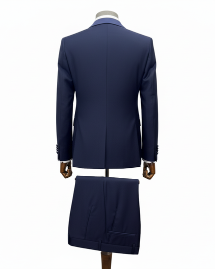 Navy blue suit on a mannequin against a white background