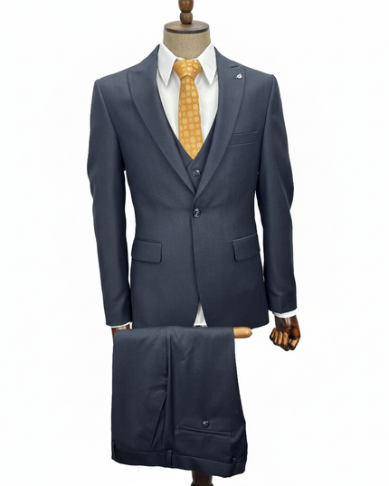 Navy suit with a yellow tie on a mannequin against a white background