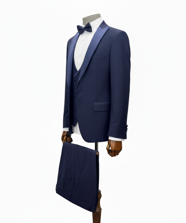 Navy blue tuxedo with matching bow tie on a mannequin against a white background