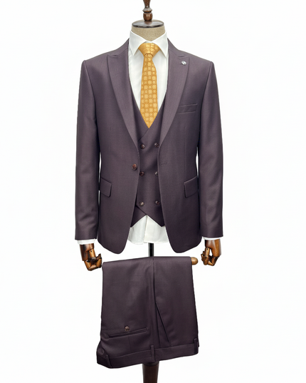 Burgundy suit with a yellow tie on a mannequin against a white background
