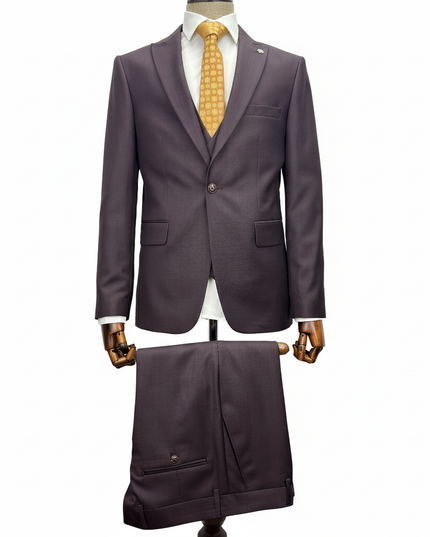 Burgundy suit with a yellow tie on a mannequin against a white background