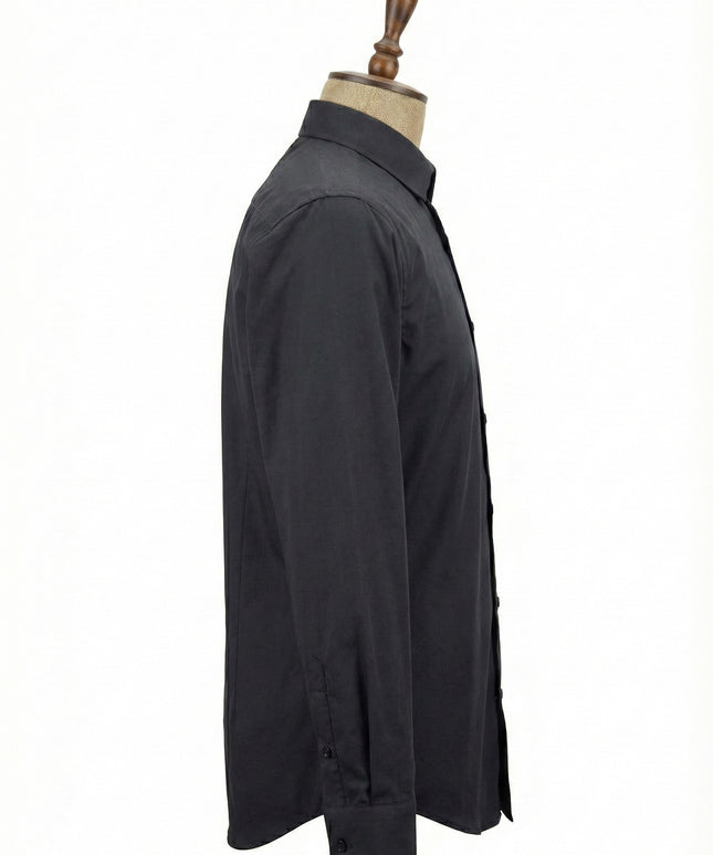 Black shirt on a mannequin against a white background