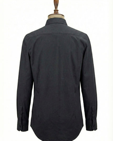 Dark gray shirt on a mannequin against a white background