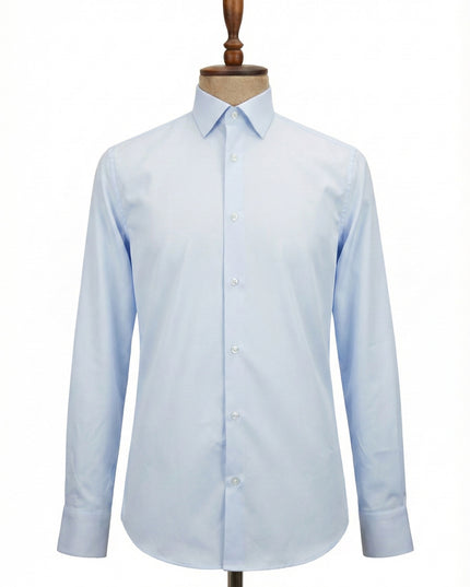 Light blue dress shirt on a wooden mannequin against a white background