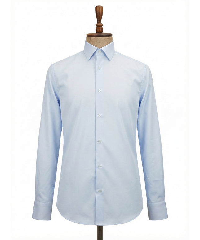 Light blue dress shirt on a wooden mannequin against a white background