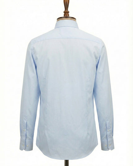 Light blue dress shirt on a mannequin against a white background