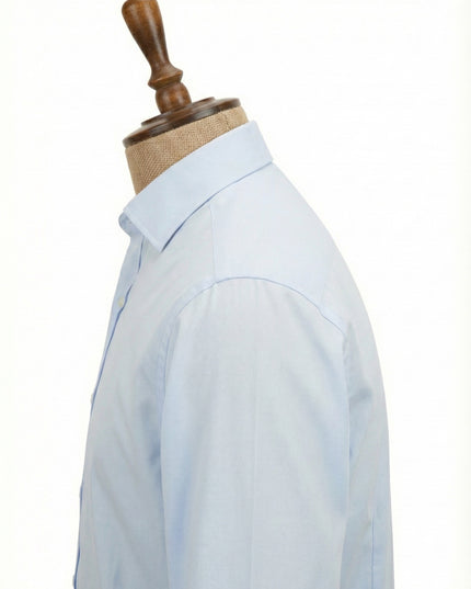 Light blue shirt on a mannequin with a white background